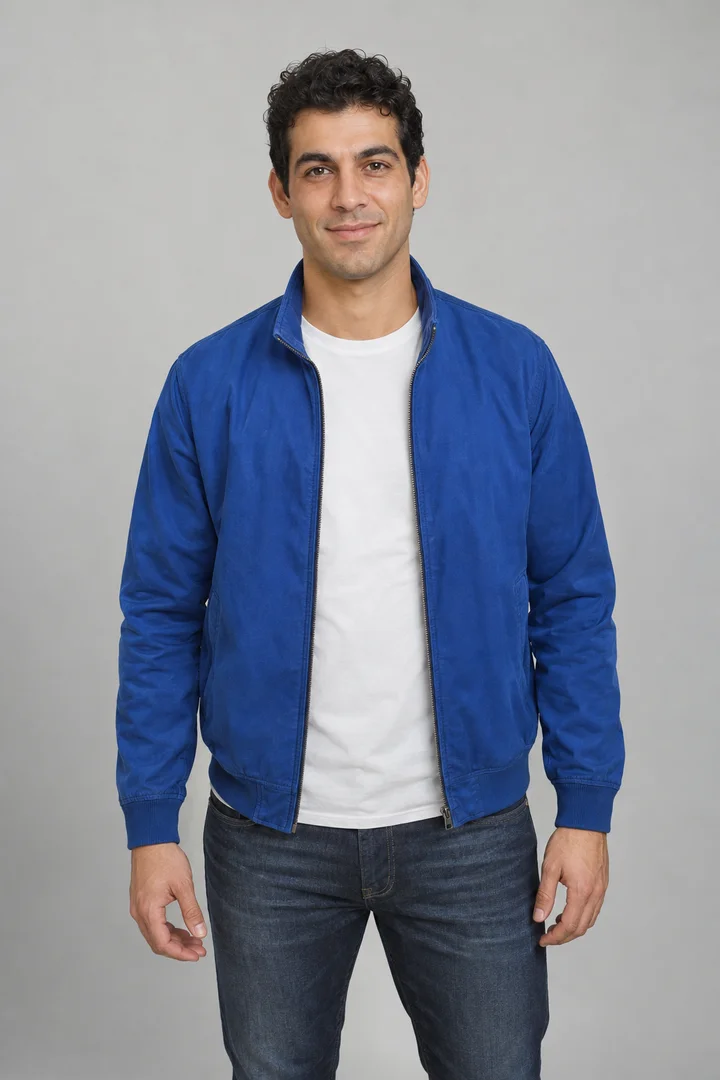 Fictional adult with short curly hair wearing a cobalt-blue jacket